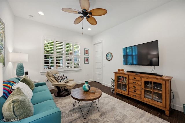 living room with dark hardwood / wood-style floors and ceiling fan