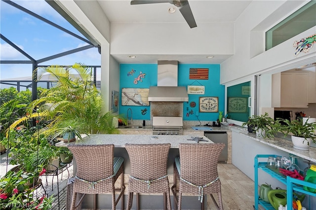 sunroom with ceiling fan and sink