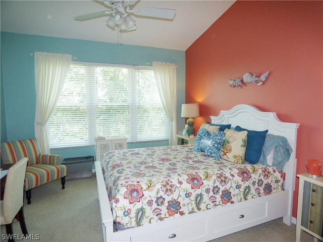 carpeted bedroom featuring ceiling fan and vaulted ceiling