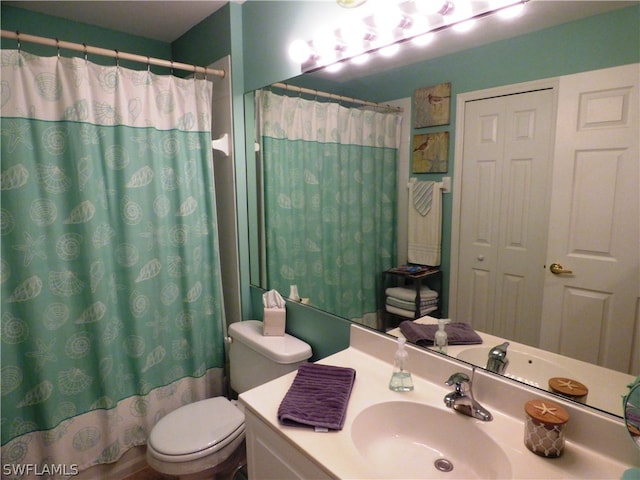 full bathroom featuring toilet, vanity, and shower / bathtub combination with curtain