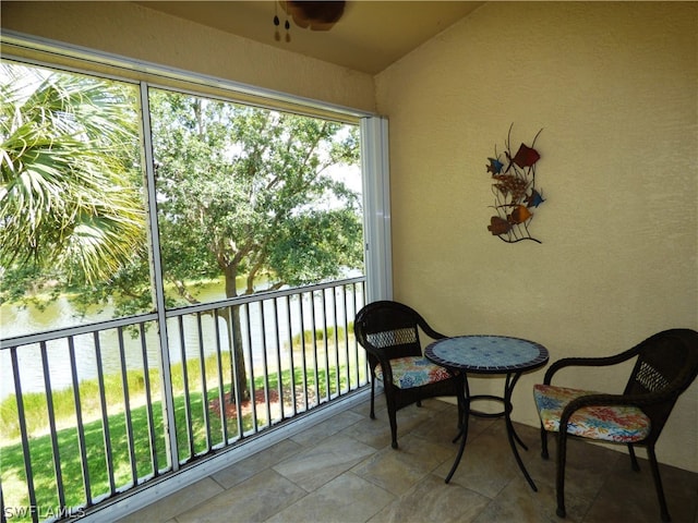 balcony featuring a water view