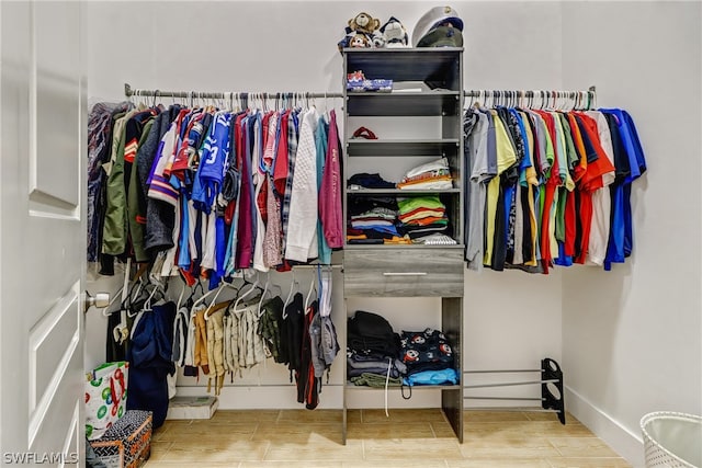 walk in closet featuring hardwood / wood-style floors