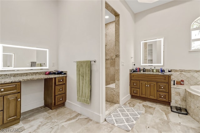 bathroom with independent shower and bath, vanity, and tile floors