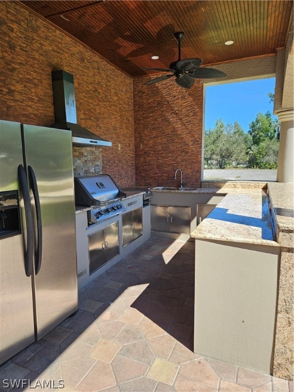 view of patio with an outdoor kitchen, ceiling fan, sink, and grilling area