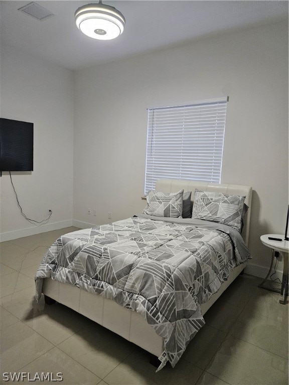 bedroom with tile floors