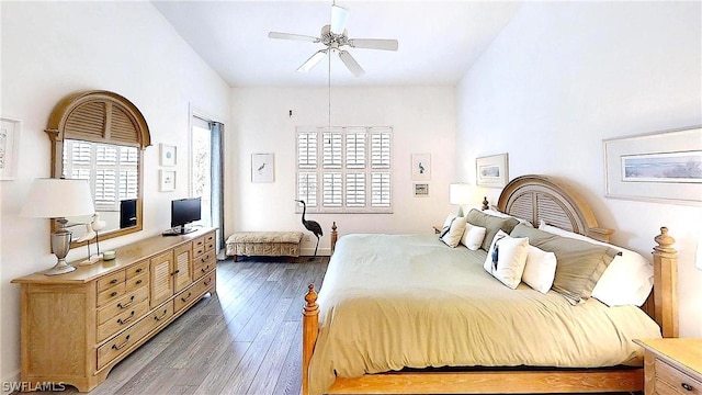 bedroom featuring ceiling fan and dark hardwood / wood-style floors