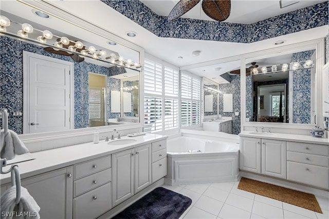 bathroom featuring a bathing tub, dual bowl vanity, and tile flooring