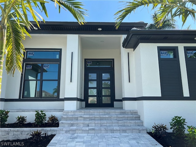 property entrance featuring french doors