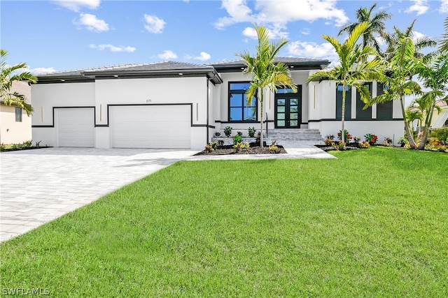 view of front facade featuring a garage and a front yard