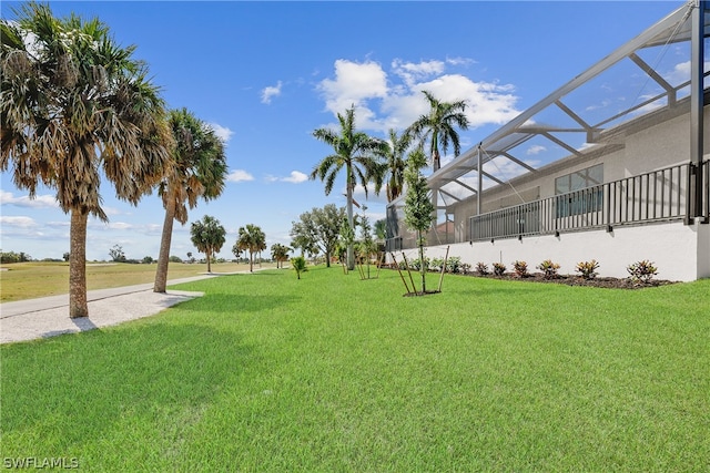 view of yard featuring a lanai