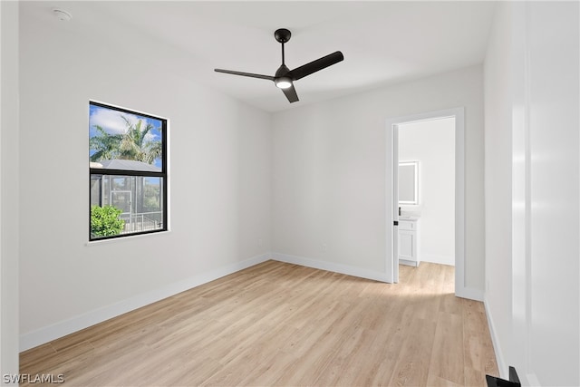 unfurnished room with ceiling fan and light wood-type flooring