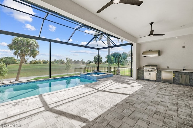 view of pool featuring a grill, glass enclosure, an outdoor kitchen, ceiling fan, and an in ground hot tub