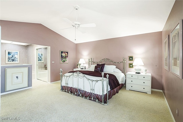 carpeted bedroom featuring lofted ceiling, connected bathroom, and ceiling fan