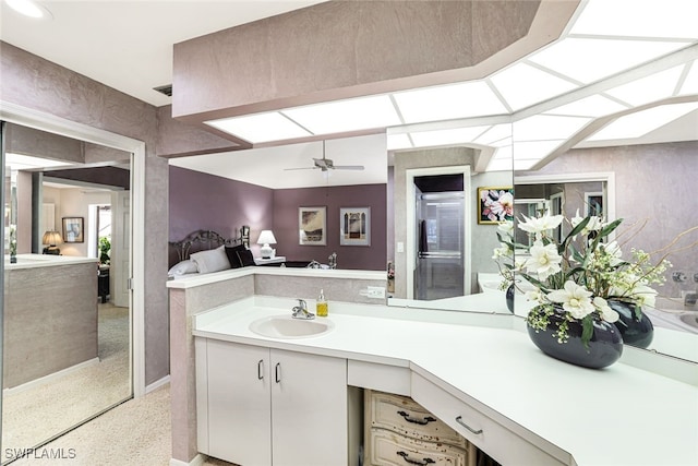 bathroom with ceiling fan and vanity