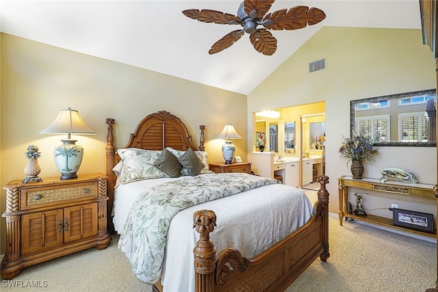 carpeted bedroom with ceiling fan, ensuite bath, and high vaulted ceiling