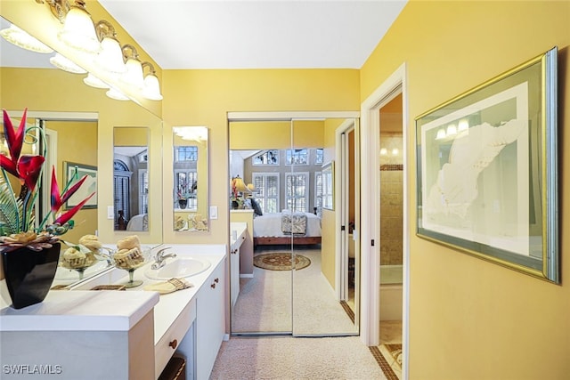 bathroom with french doors and vanity