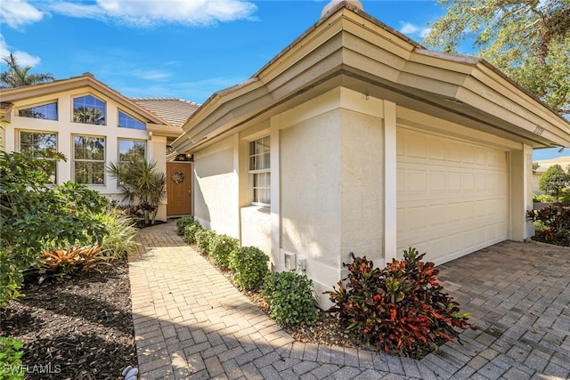 view of property exterior with a garage