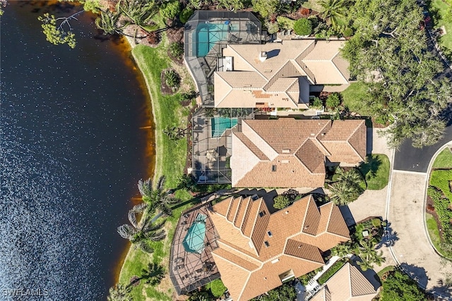 birds eye view of property with a water view