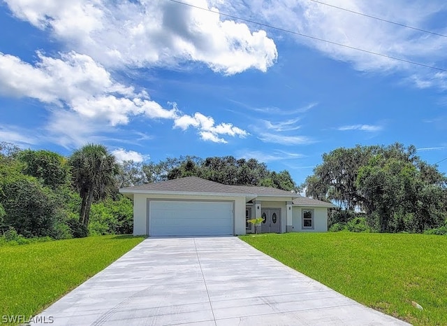 ranch-style home featuring an attached garage, driveway, a front yard, and stucco siding