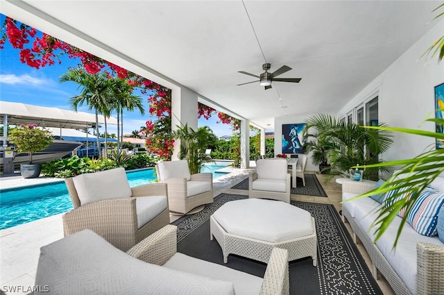 view of patio / terrace with an outdoor pool, ceiling fan, and an outdoor hangout area