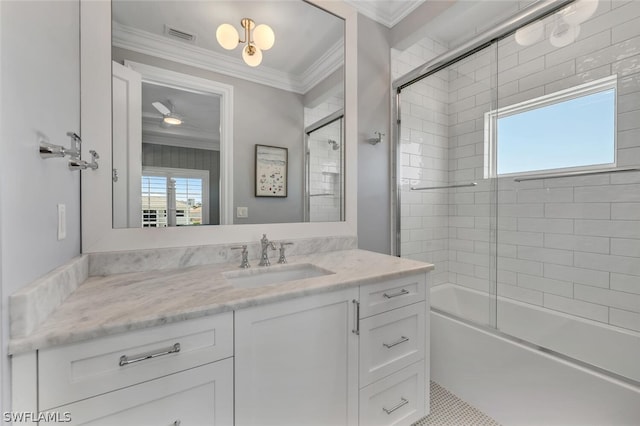 full bathroom with visible vents, combined bath / shower with glass door, crown molding, and vanity