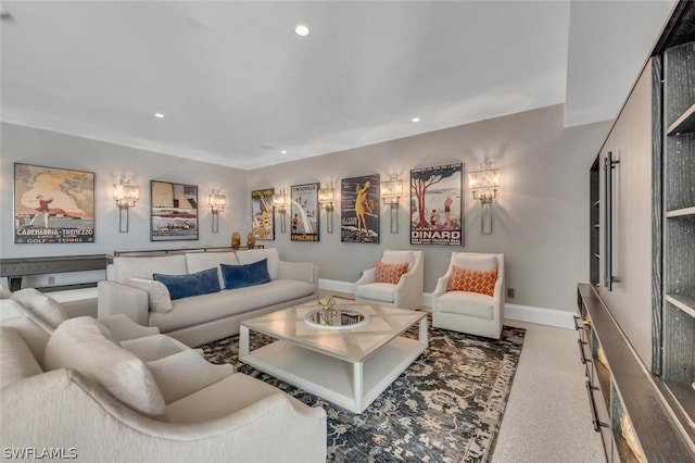 living room with carpet floors, recessed lighting, and baseboards