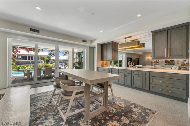 kitchen featuring light countertops, french doors, recessed lighting, and a healthy amount of sunlight