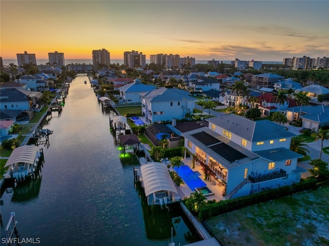 aerial view with a view of city and a water view