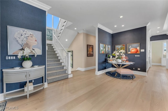 foyer featuring stairway, wood finished floors, and baseboards