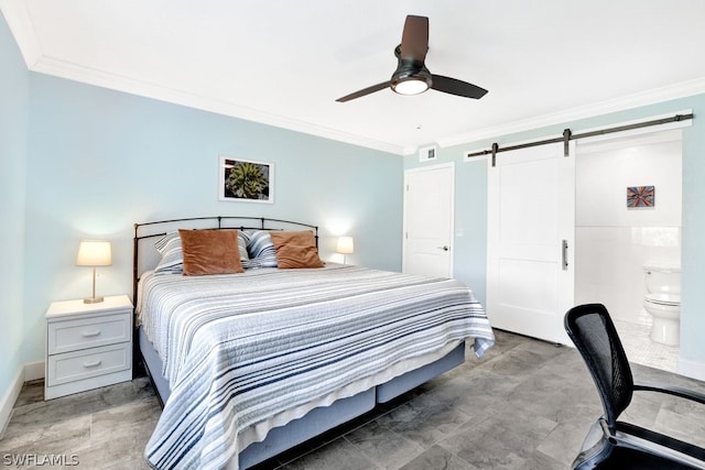 bedroom with a barn door, ceiling fan, crown molding, and ensuite bath