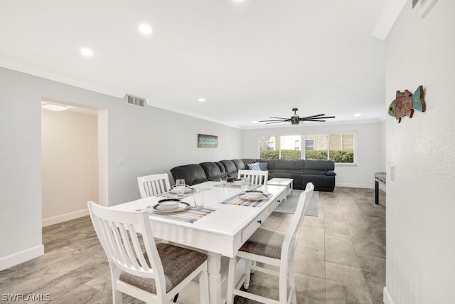 dining room with ceiling fan and ornamental molding