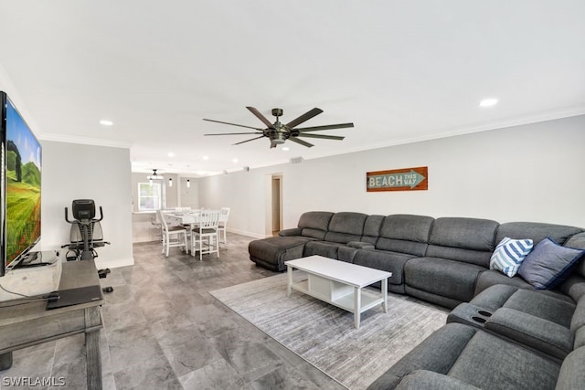 living room featuring ceiling fan and ornamental molding