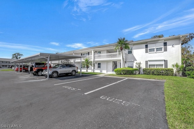 view of vehicle parking featuring a carport