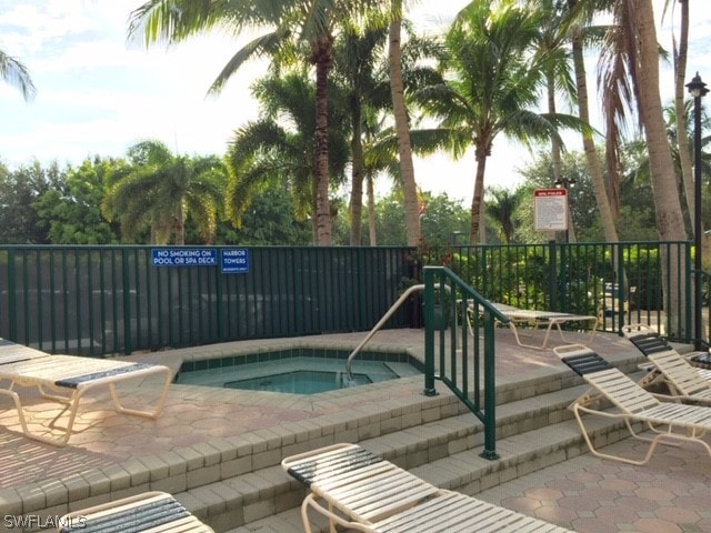 view of pool featuring a hot tub