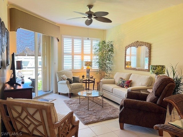 living room with light tile flooring and ceiling fan