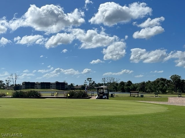 view of property's community with a lawn