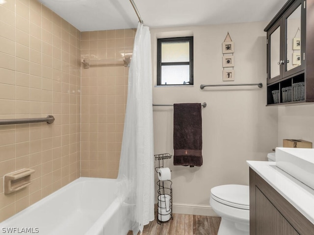 full bathroom with toilet, shower / bath combo, vanity, and wood-type flooring