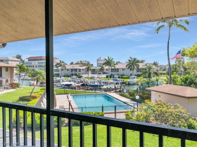 view of swimming pool with a lawn