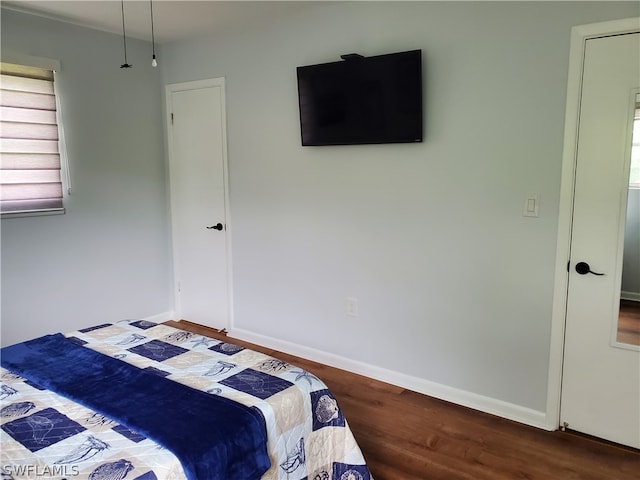 bedroom with wood-type flooring