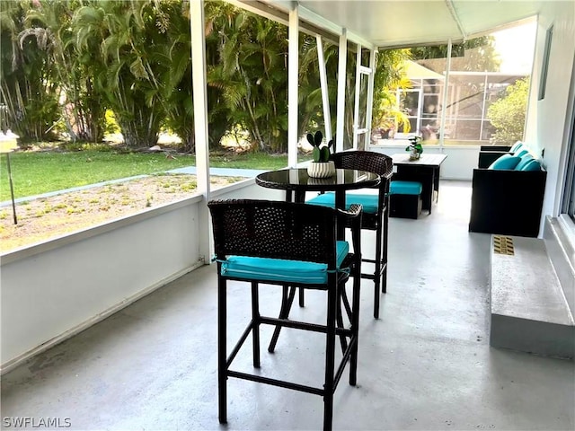 sunroom / solarium featuring plenty of natural light