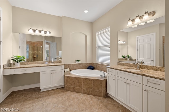 bathroom featuring vanity, tile patterned floors, and separate shower and tub