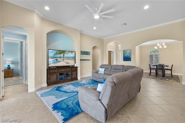 tiled living room featuring ceiling fan with notable chandelier and ornamental molding