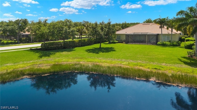 birds eye view of property with a water view