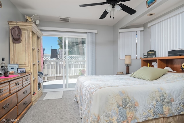 bedroom featuring light carpet, ceiling fan, and access to exterior