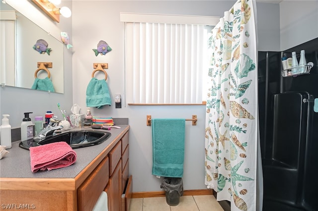 bathroom featuring vanity and tile floors