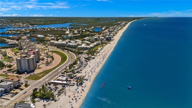 birds eye view of property featuring a water view and a view of the beach