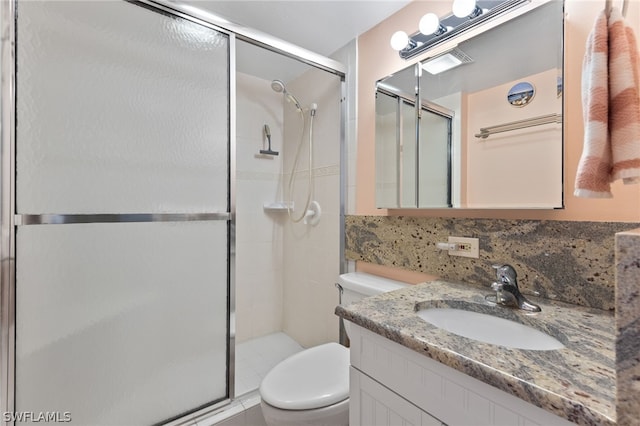 bathroom with walk in shower, toilet, and vanity