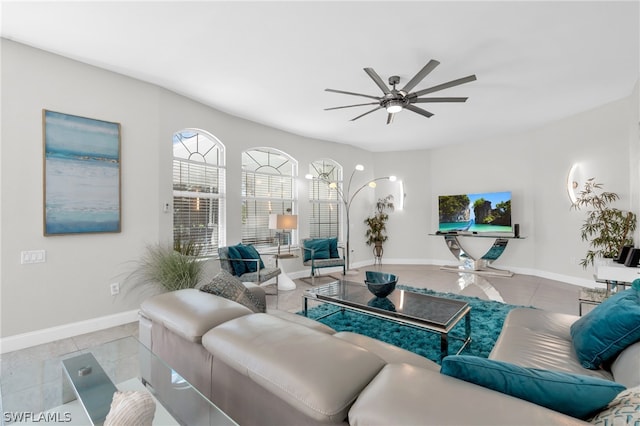 tiled living room with ceiling fan