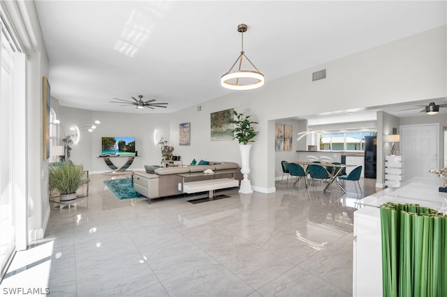 living room featuring ceiling fan