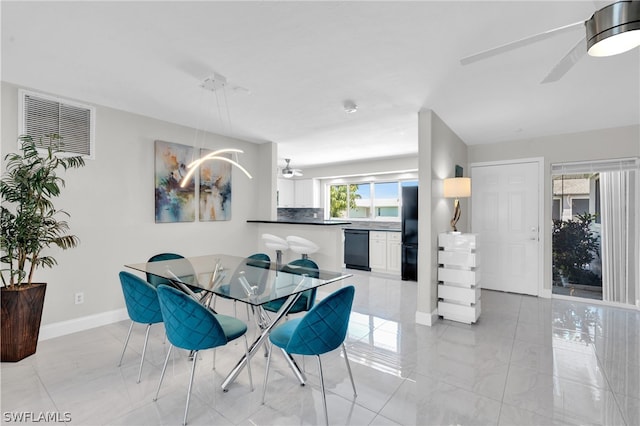 dining room featuring ceiling fan